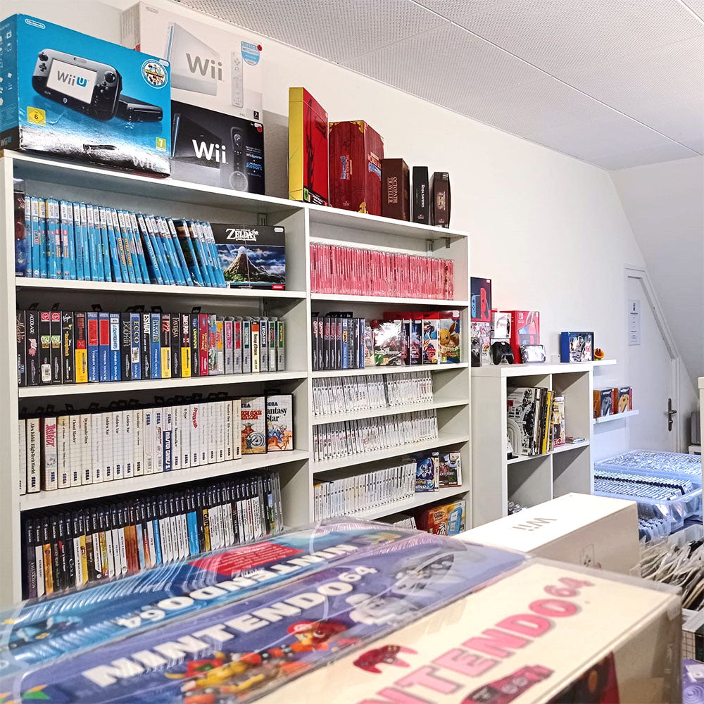 Foto von Zockbar Laden Regalwand mit Wii, Switch, 3DS, GameCube und weiteren Games