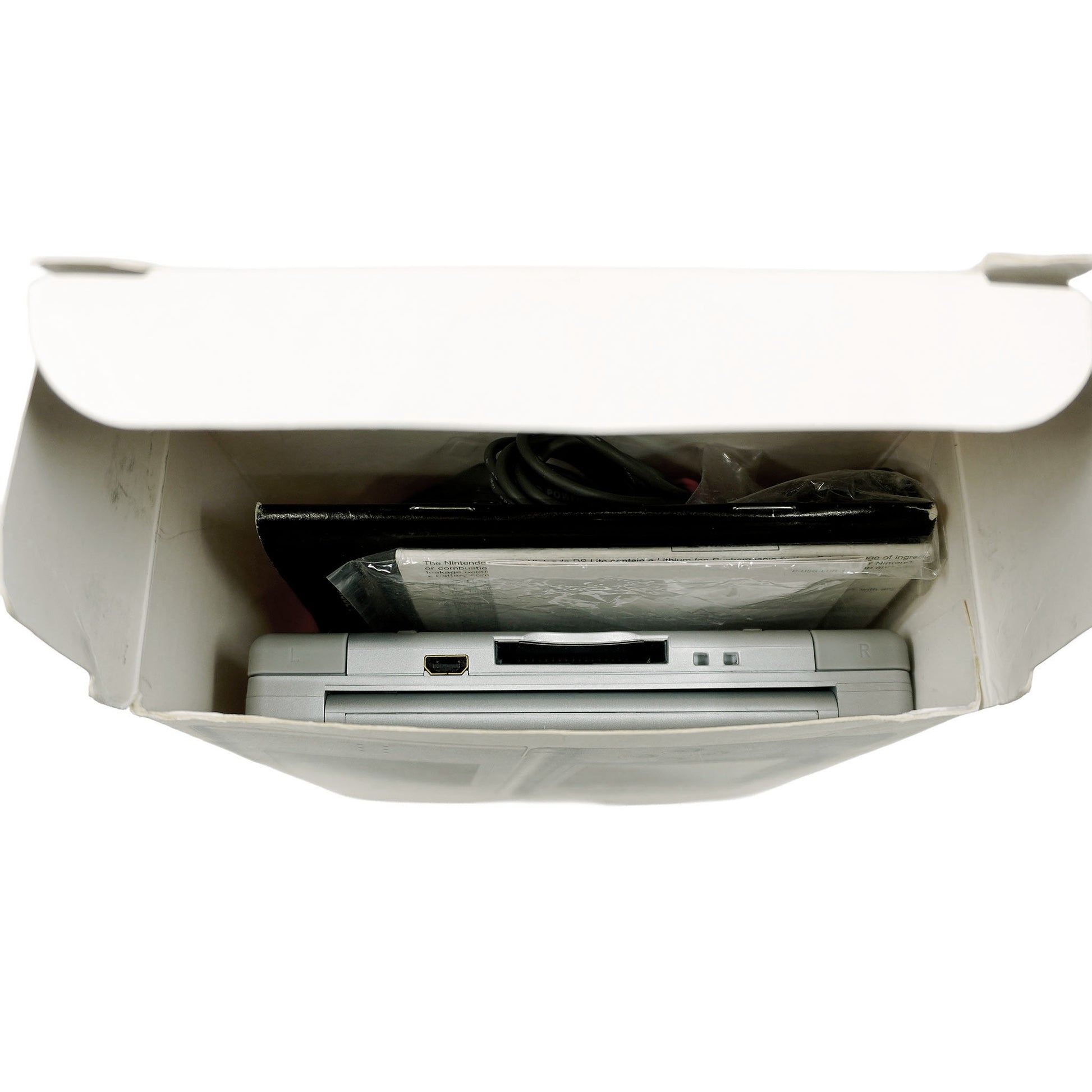 Nintendo DS Lite Handheld-Konsole in Originalverpackung - Produktfoto Box seitlich geöffnet